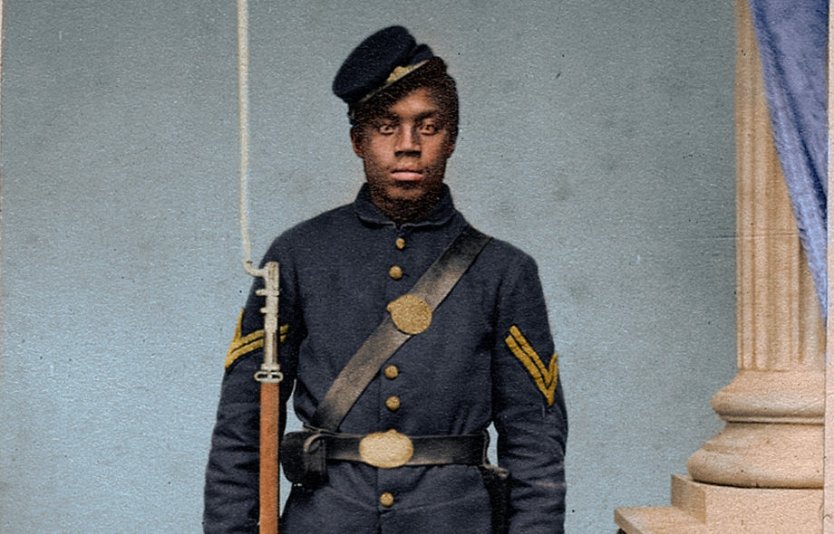 This is a colorized historic photo of a United States Colored Troop Soldier