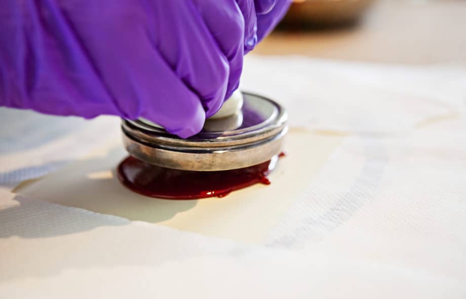 A wax seal being applied to a document.