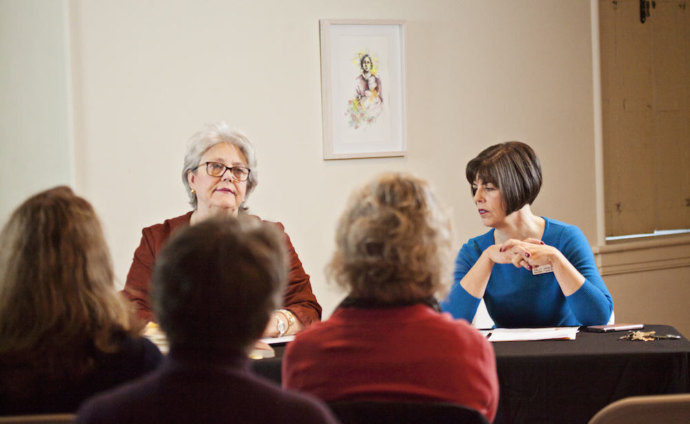 Women leading a discussion.