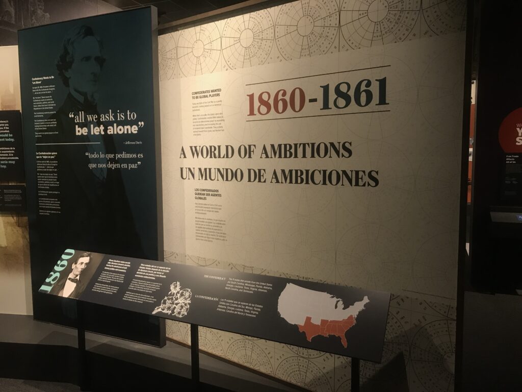 A panel from the Southern Ambitions Exhibit saying "1860-1861: A World of Ambitions"