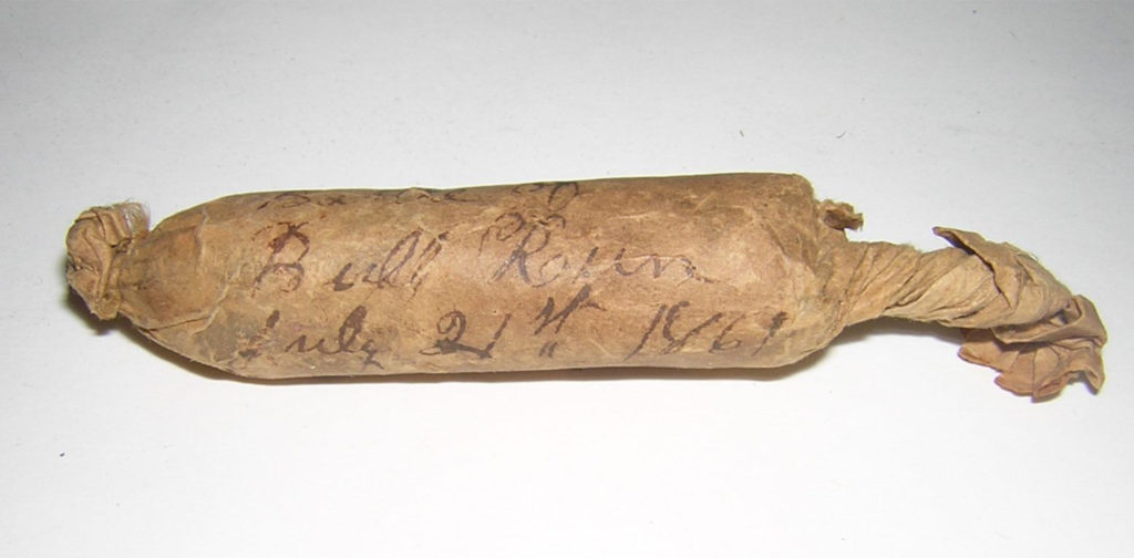 Paper wrapped charge with hand-written ink inscription: “Carried onto the field at the battle of Bull Run, July 21, 1861.”