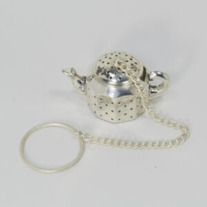 small metal tea infuser shaped like a tea pot, on a chain